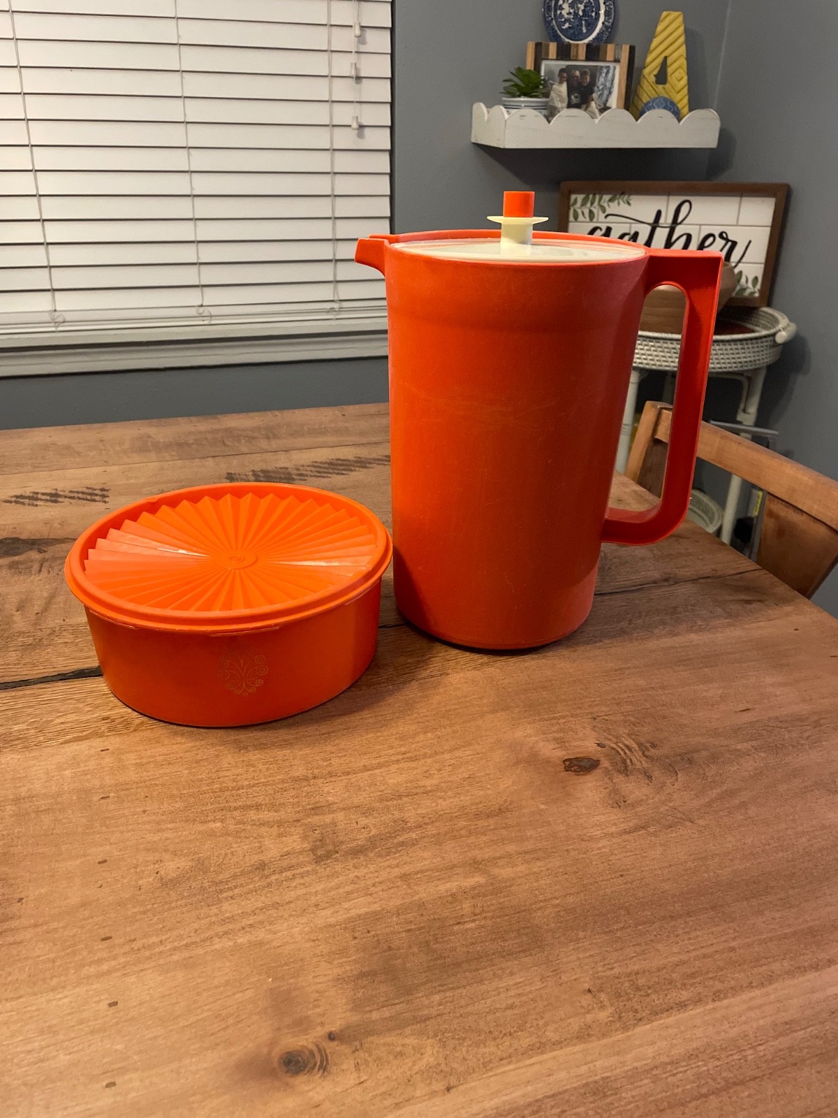 Vtg tupperware orange pitcher and push top round canister Vtg tupperware orange pitcher and push top round canister