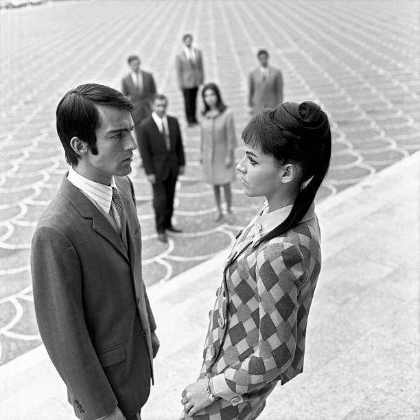 Two young people love looking into each other eyes Their exclusive- Old Photo