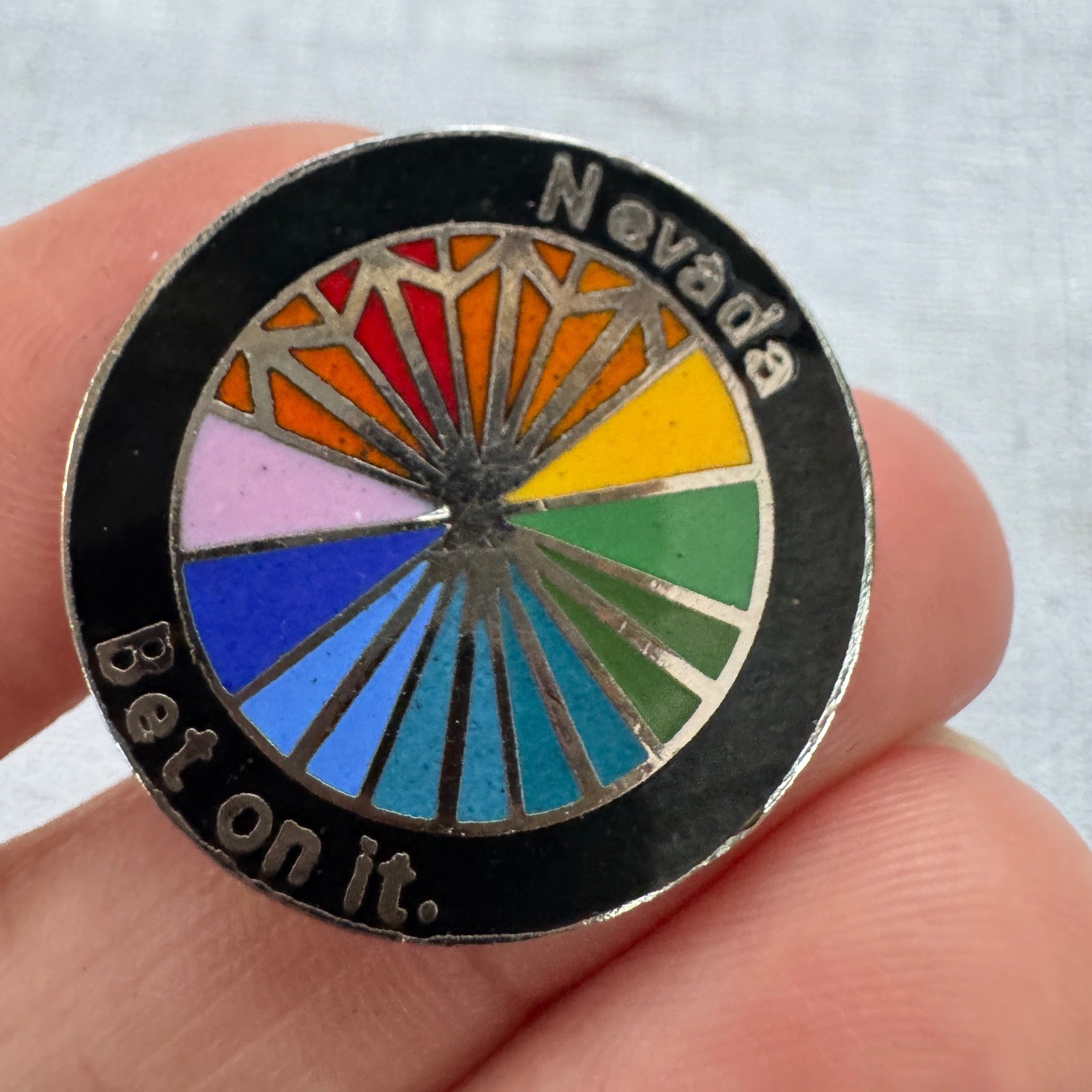 Vintage Nevada Bet On It Rainbow Wheel Enamel Pin Black Silver Casino Souvenir