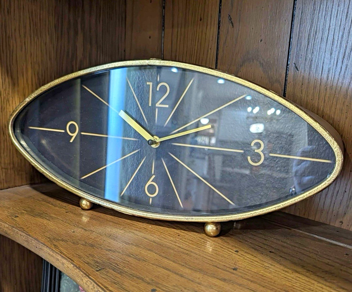 Rare vintage mid century clock metal glass cats eye