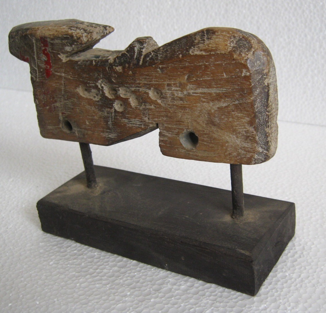 ANTIQUE WOODEN COW ON STAND UNUSUAL DECORATIVE FIGURINE .