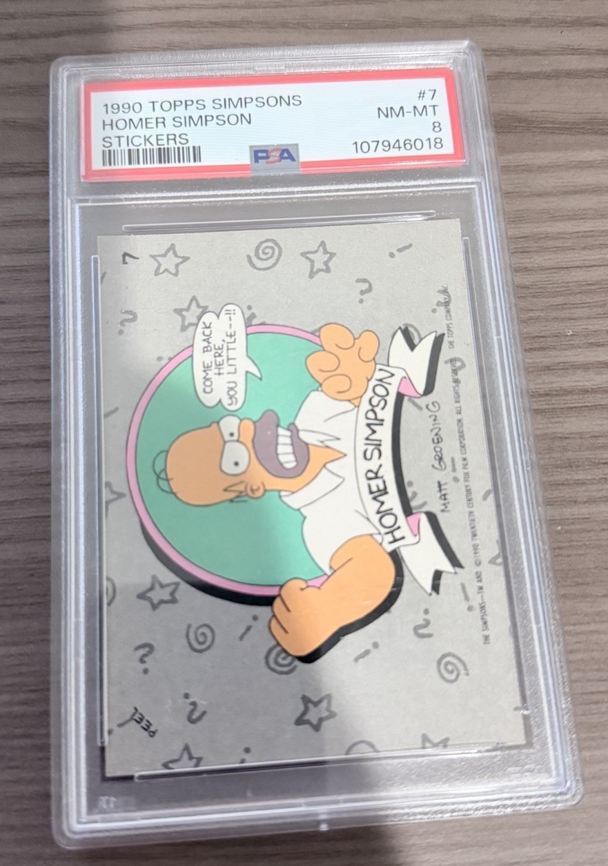 1990 Topps The Simpsons #7 Homer Simpson ROOKIE Stickers PSA 8 1990 Topps The Simpsons #7 Homer Simpson ROOKIE Stickers PSA 8