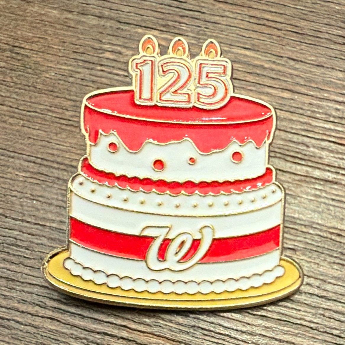 125th anniversary pin. Walgreens. Celebration cake.