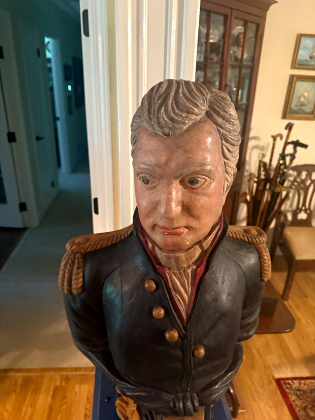 A ship’s figurehead of Lord Admiral Horatio Nelson, with a walking stick.
