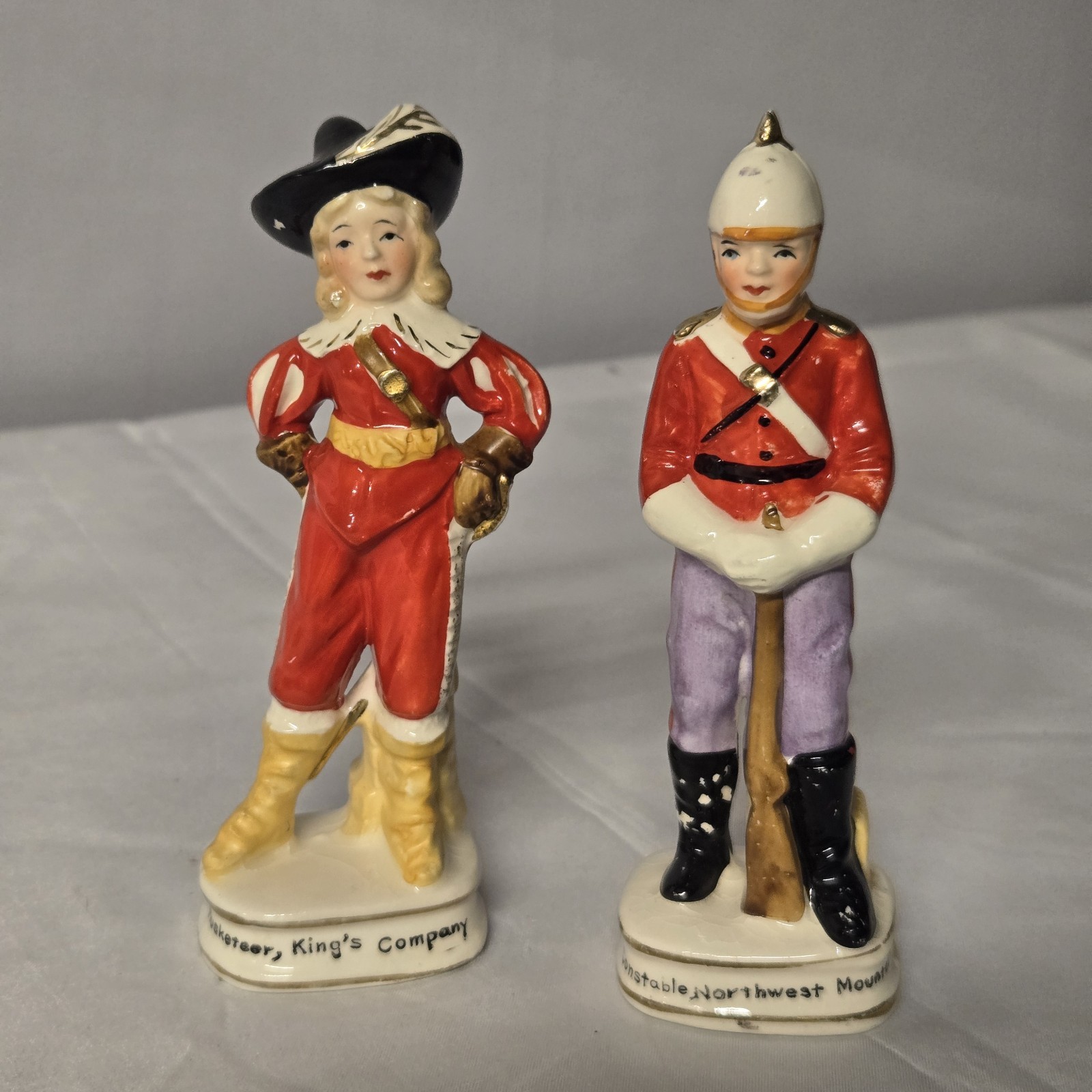 2 Vintage Enesco Japan Porc. Figures Musketeer King's Comp. & NWMP Canada E21