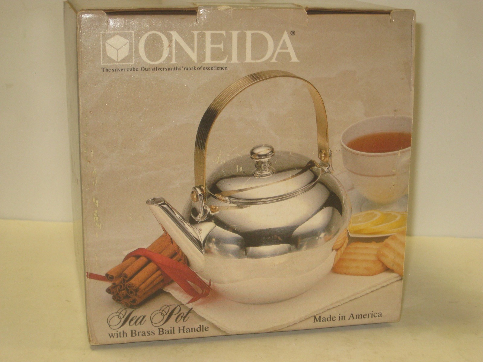 NOS ONEIDA SILVERPLATED TEA POT WITH BRASS BAIL HANDLE USA MADE