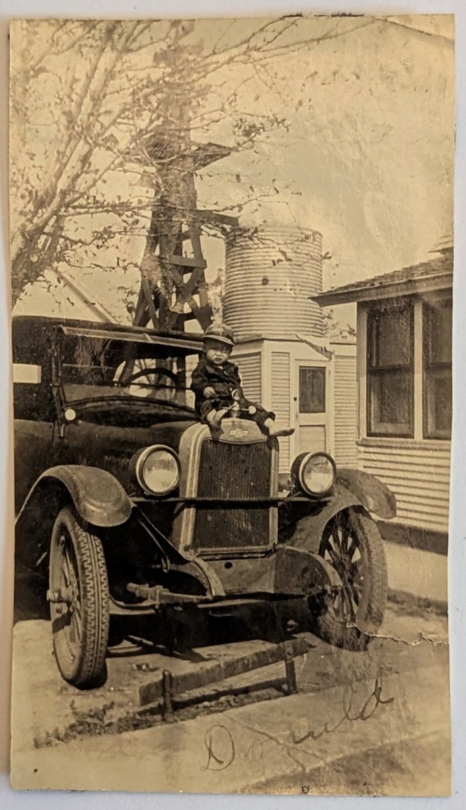 ​​​​​​Antique 1920s Photo Toddler Sitting on Car Hood Radiator Windmill Farm