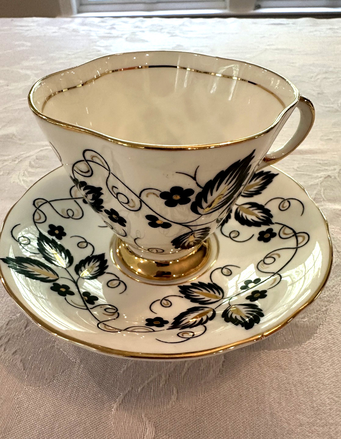 Vintage Clarence Bone China Teacup and Saucer England Black, White, and gold Vintage Clarence Bone China Teacup and Saucer England Black, White, and gold