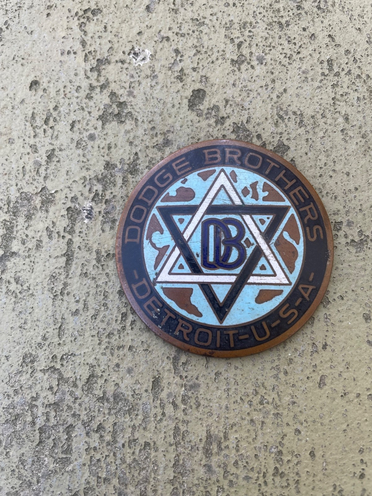 Oridinal early brass Dodge Brothers radiator shell emblem