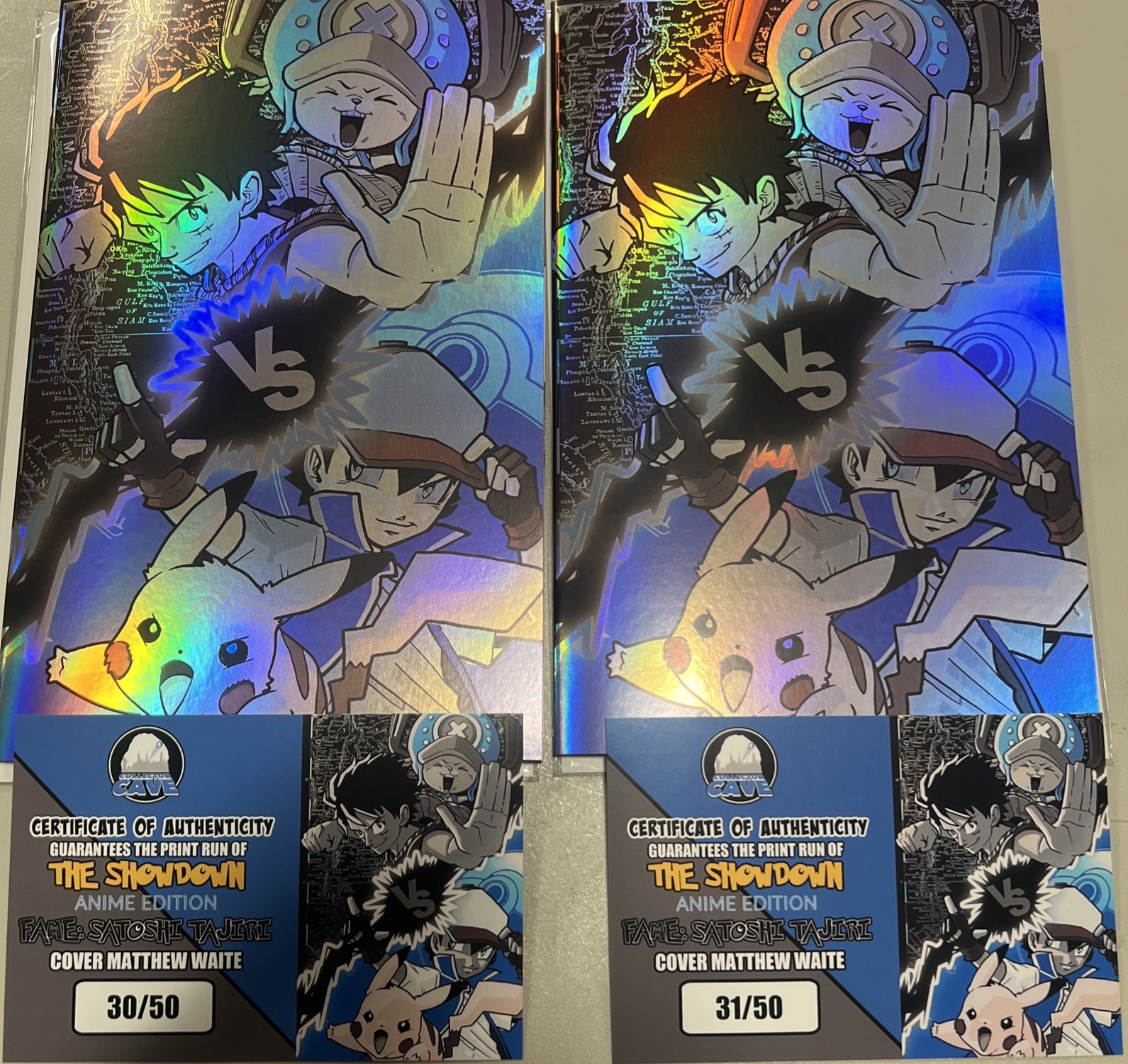 1-Fame: Satoshi Tajiri -The Showdown, One Piece Vs Pokemon Blue Foil-Ltd Only 50