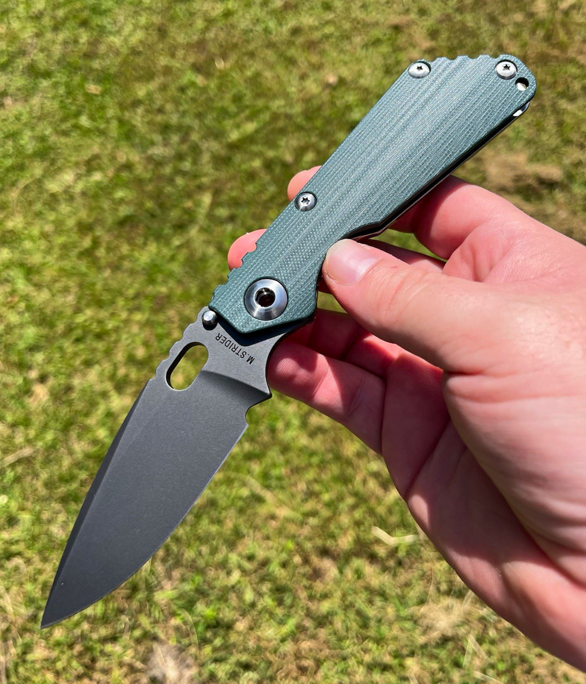 M. Strider SNG Pocketknife Green G-10, Black Stainless Drop Point Plain, Clip