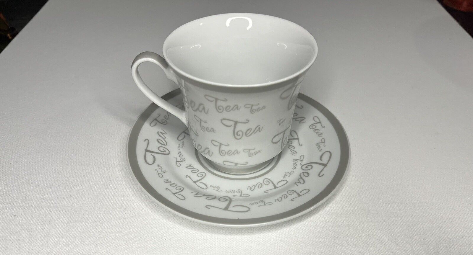 Darice TeaCup and Saucer White and Gold With “Tea” Written.
