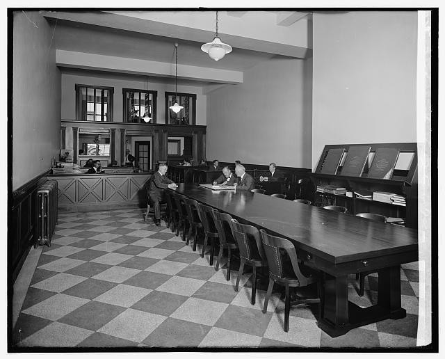 Photo:McKeever & Goss Office Interior 1920s Conference Room Men Seated