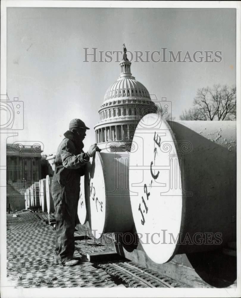 1959 Press Photo Worker Checks over Building Supplies near the Capitol in D.C.