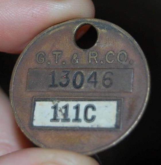 VINTAGE GOODYEAR TIRE & RUBBER  G.T. & R. BRASS ADVERTISING TAG AKRON OHIO