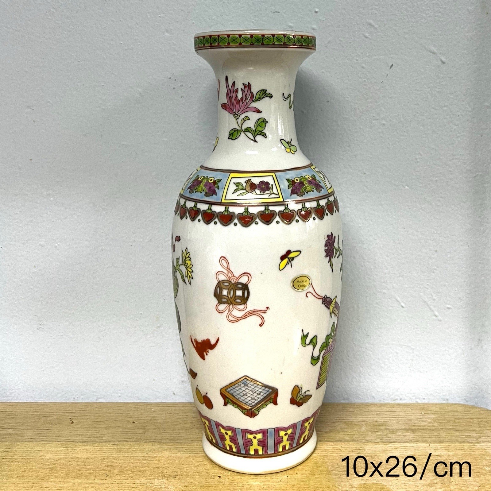 Porcelain Vase with 'Eight Daoist Treasures' Motif in Famille Rose Enamels