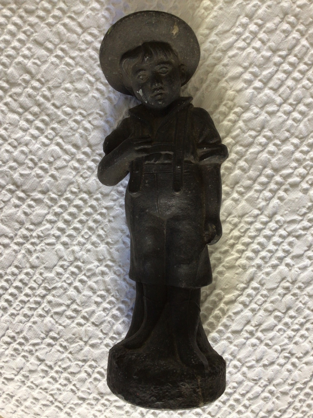 Victorian Pot Metal Figure of Boy Wearing a Wide Brim Hat Suspenders and Boots