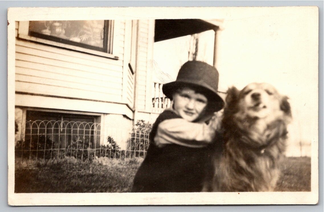 c1910 Boy Hugging Dog Wearing Oversized Hat House Vintage B&W RPPC Postcard