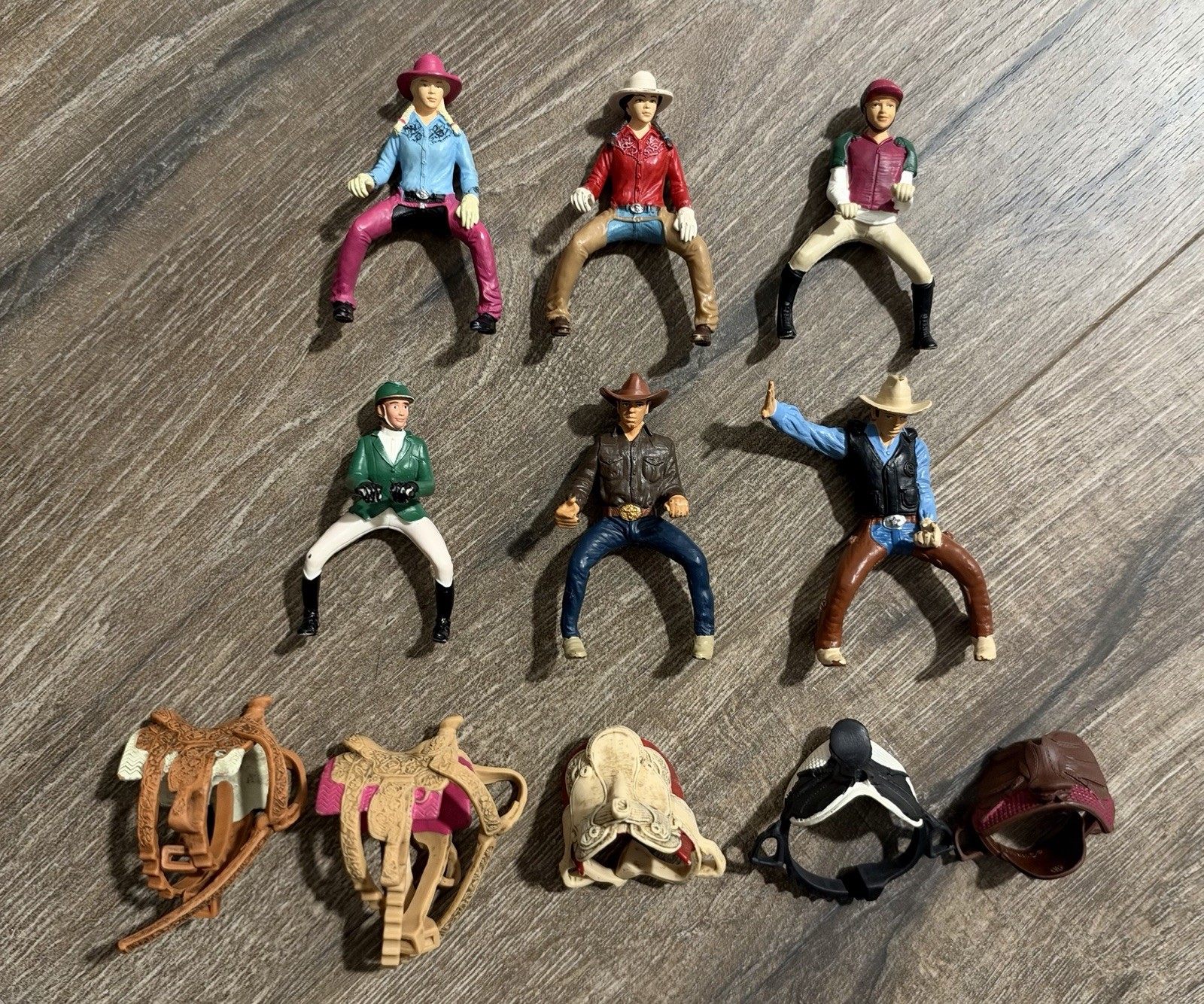 Lot of 11 - Schleich Riders & Saddles 