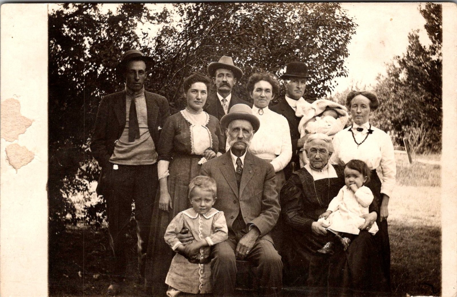 Antique RPPC Postcard Extended Family Group Portrait Outdoors Hats 1910s