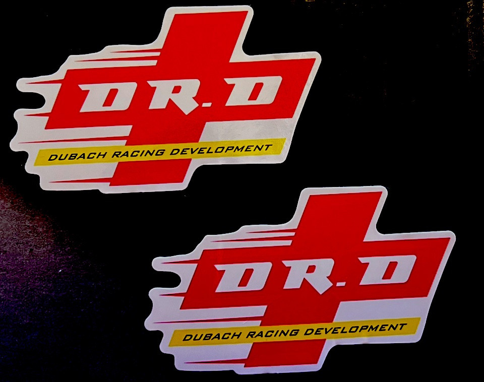 2- DR. D DUBACH RACING DEVELOPMENT Stickers. Size:3”X 2”. *Glossy*Finish. Self A
