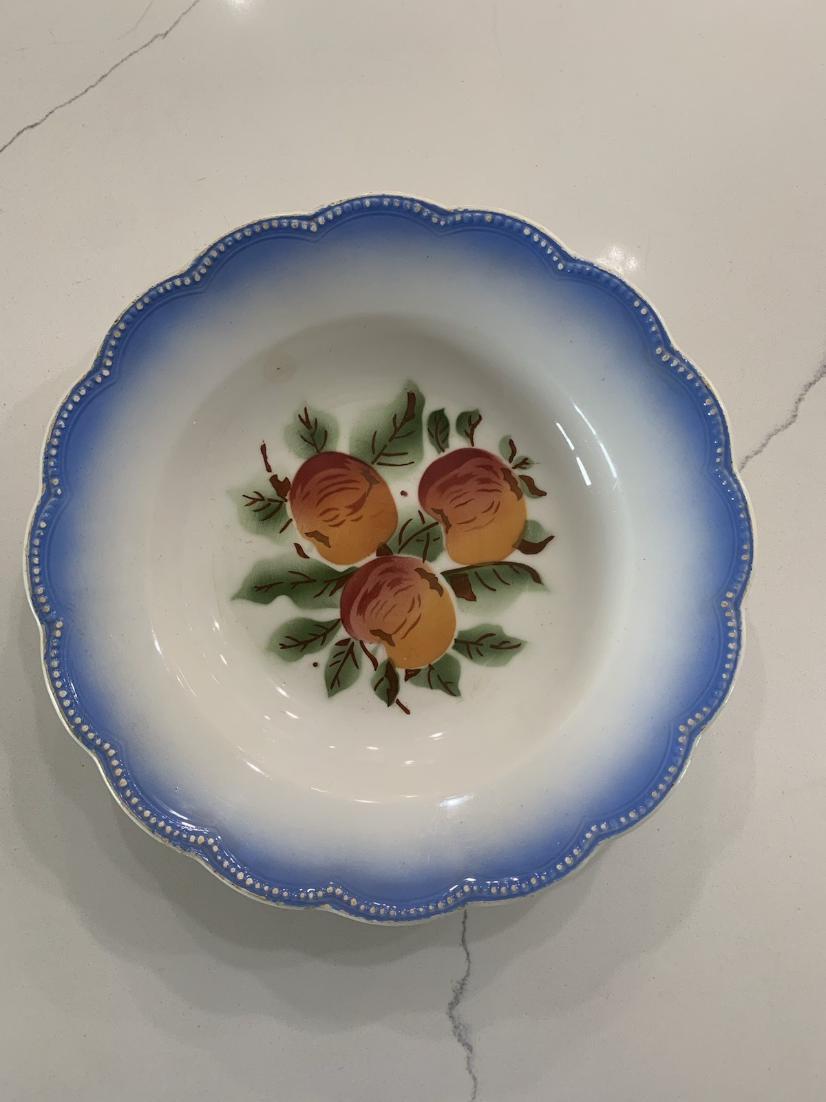 Antique German 9” Bowl Featuring Peaches In Center With Blue Border. ￼