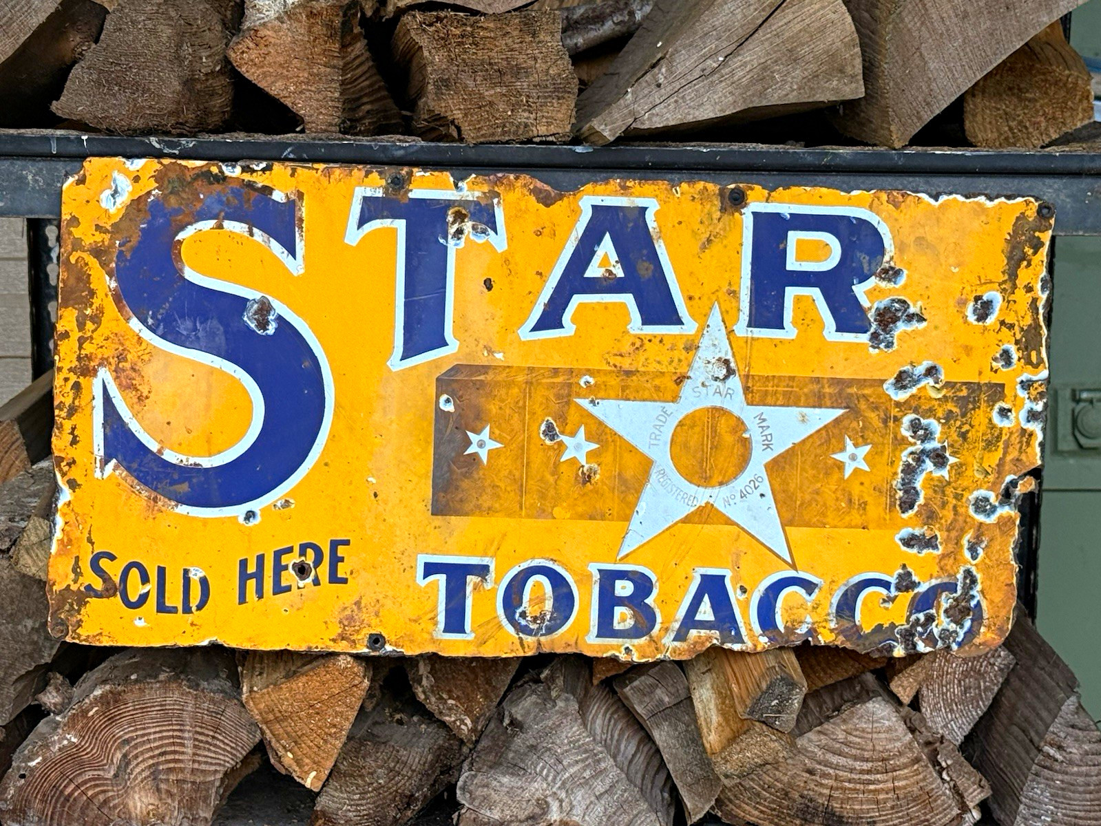 This is an absolutely unique, antique 1920s-1930s Star Tobacco advertising sign