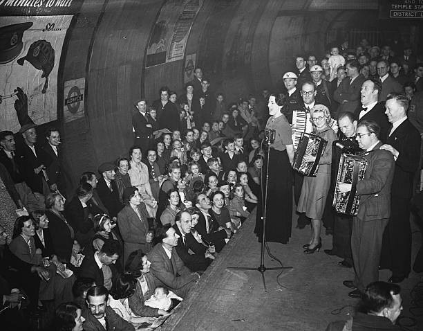 Members of the public watching a performance by the Entertainments- Old Photo