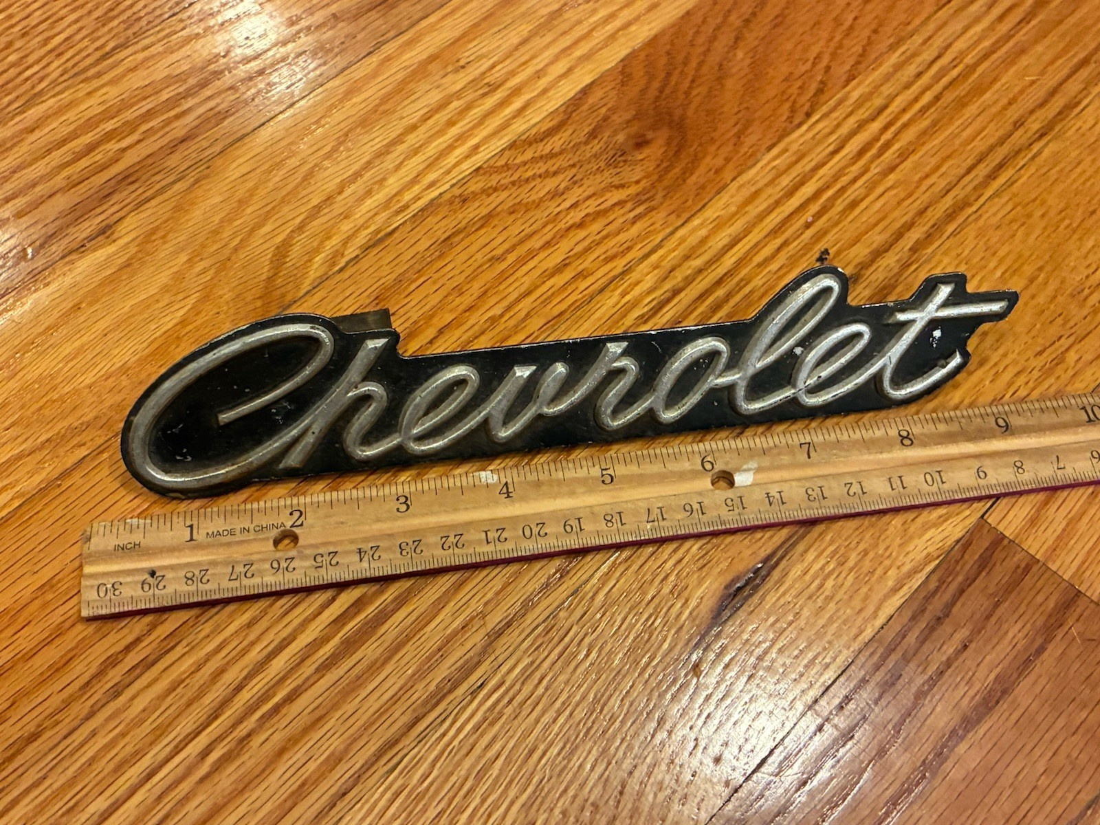 VINTAGE CHEVROLET SCRIPT BADGE EMBLEM TRIM WITH MOUNTING- MEASURES 9 INCHES LONG
