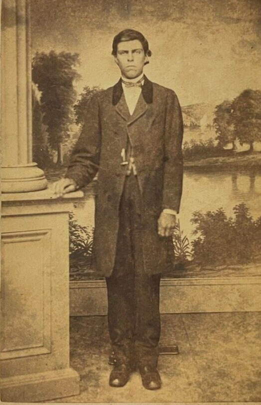 ANTIQUE CDV PHOTO DRESSED-UP  SERIOUS YOUNG MAN WEARS LONG COAT SHINY SHOES GOOD
