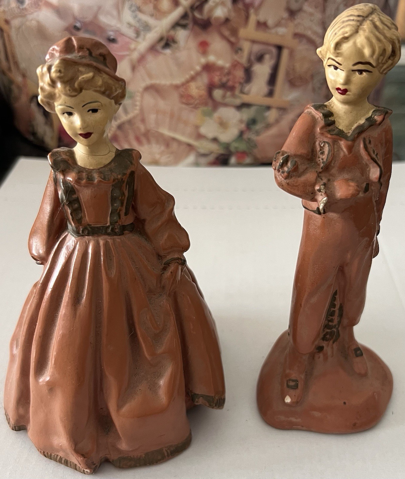 Vintage pair of hand-painted chalkware or ceramic colonial-style figurines