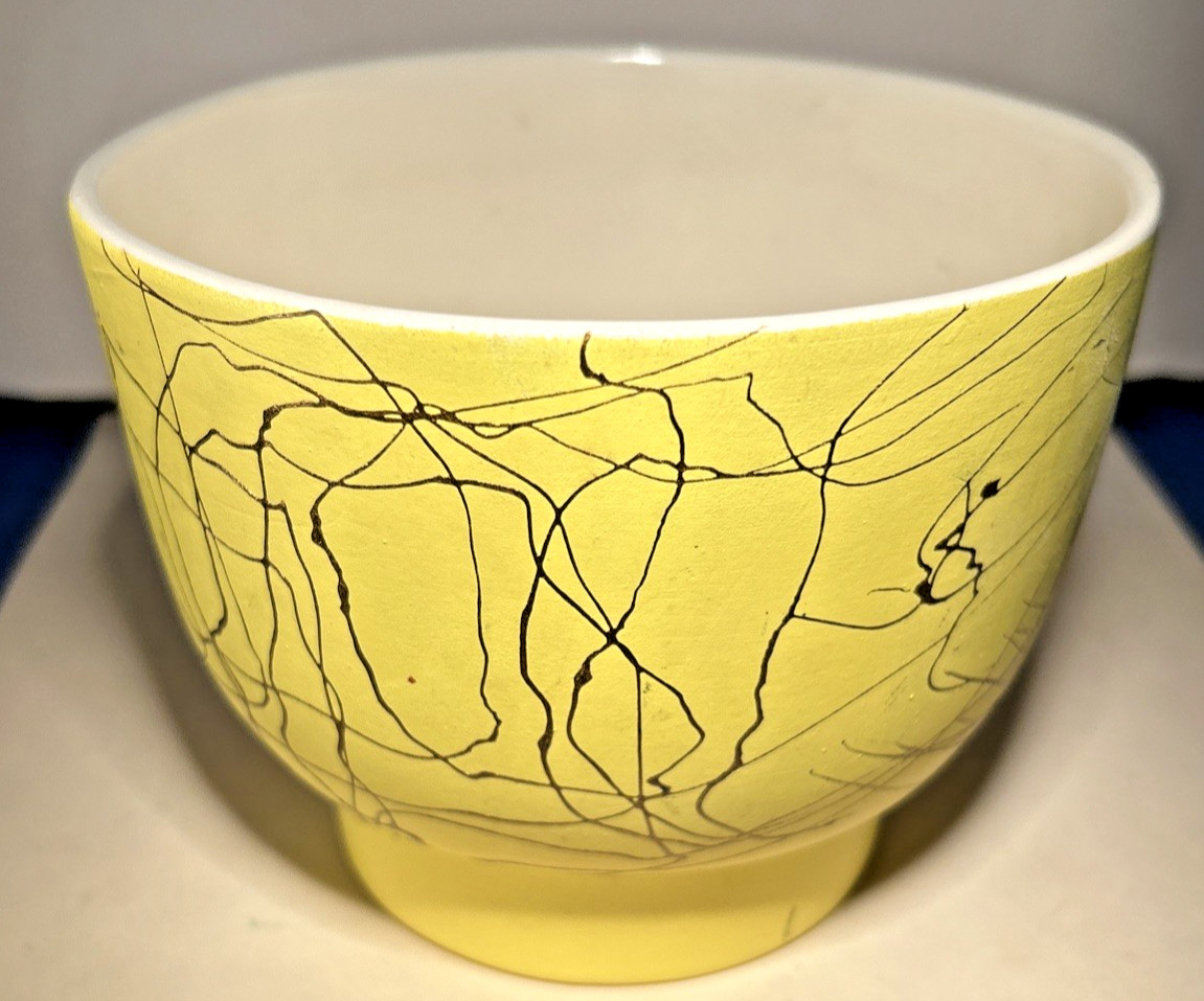 Maddux Small Yellow Vase With White Interior And Random Gold Streamers Outside