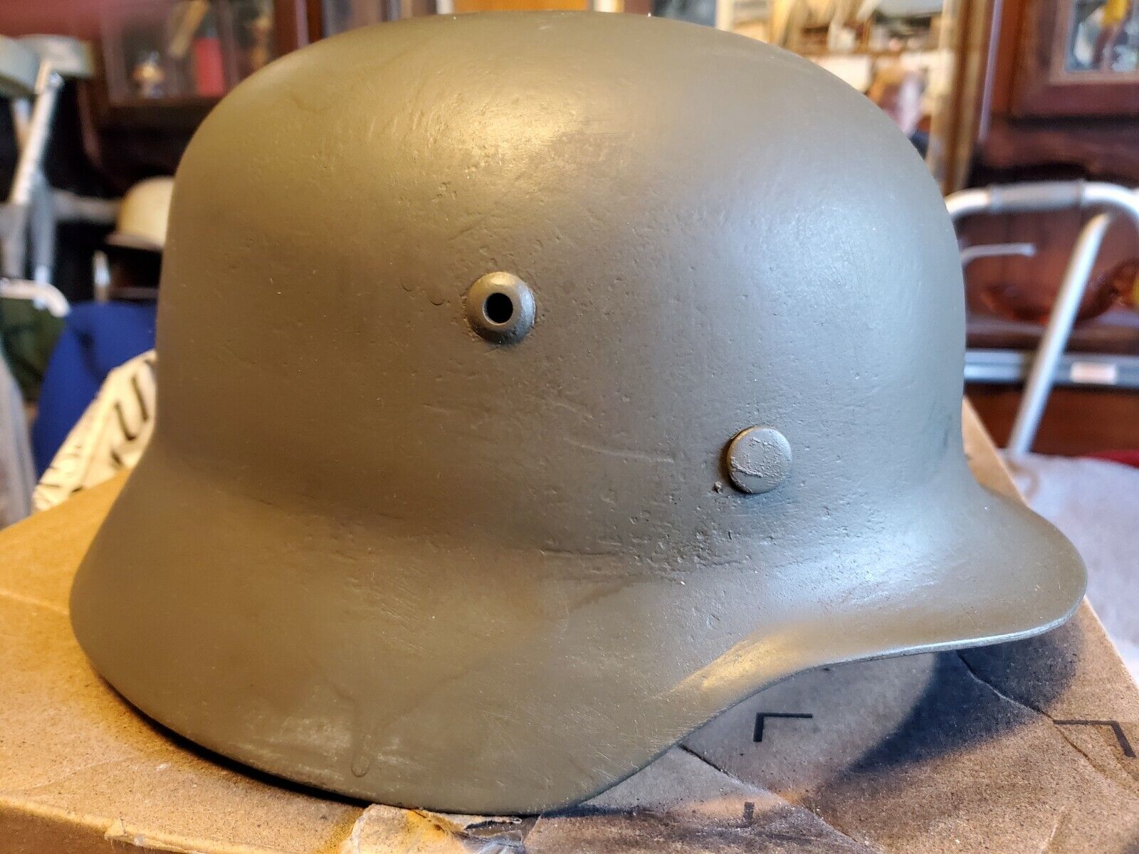 M  35 German helmet with original liner and chinstrap pieces makers mark Q64.