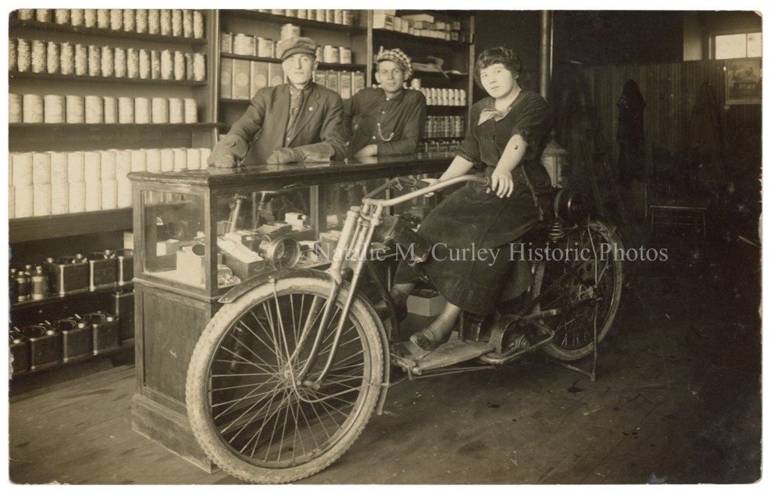 1910s Midwest Store w/ Woman on Motorcycle RPPC Photo 1910s Midwest Store w/ Woman on Motorcycle RPPC Photo