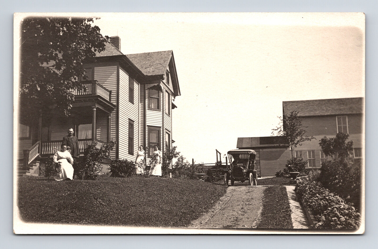 RPPC View of Family Posing by Large House Early Car Women Man Americana Postcard