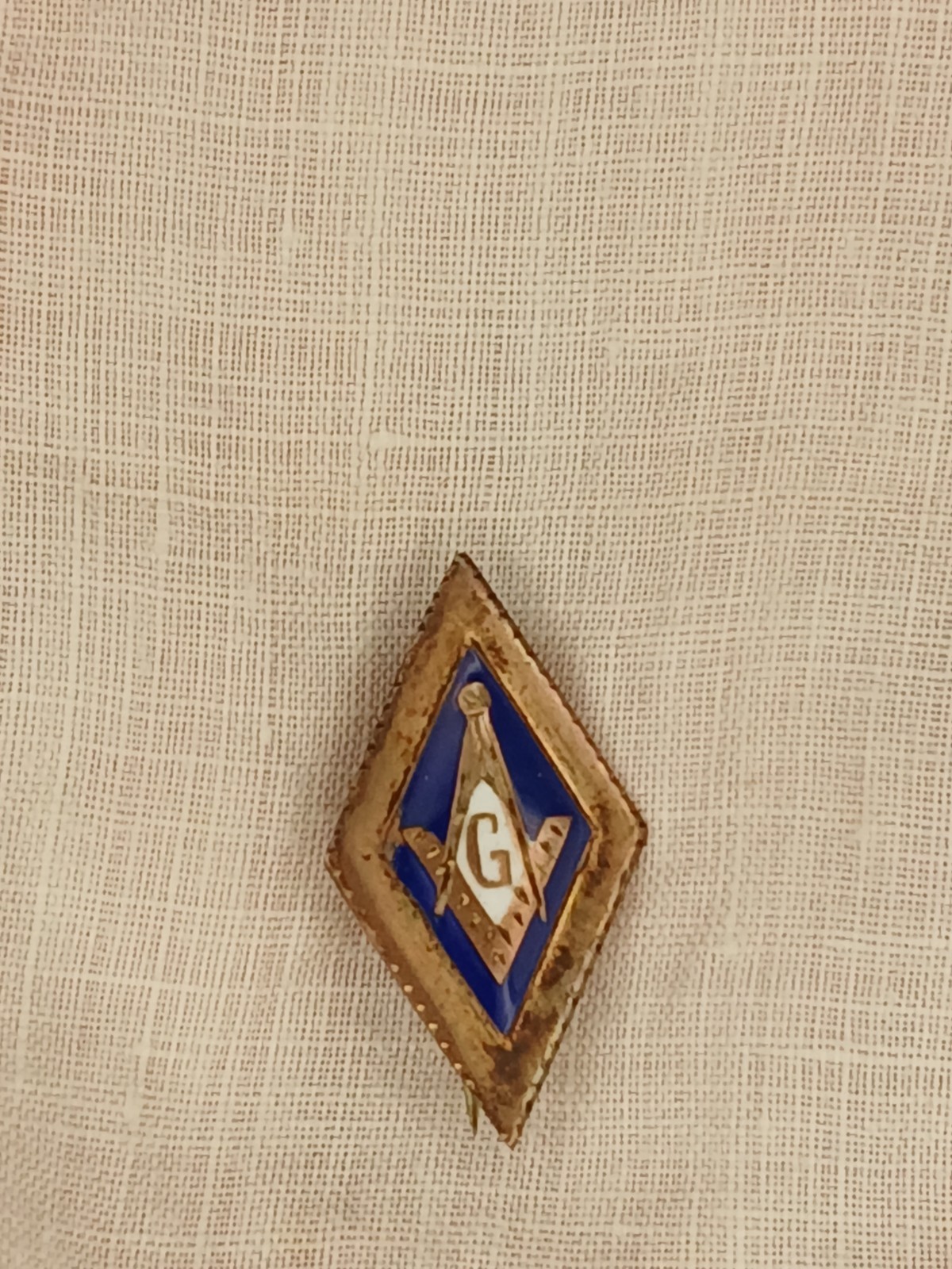 vintage turn of the 20th century Masonic square and compasses enamel lapel pin