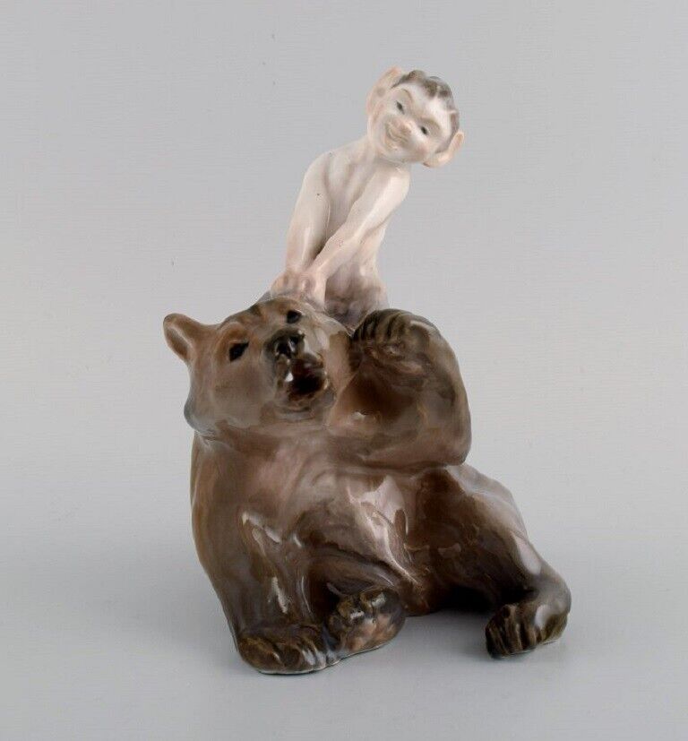 Royal Copenhagen porcelain figurine. Faun pulling bear\'s ear. Model number 1804.