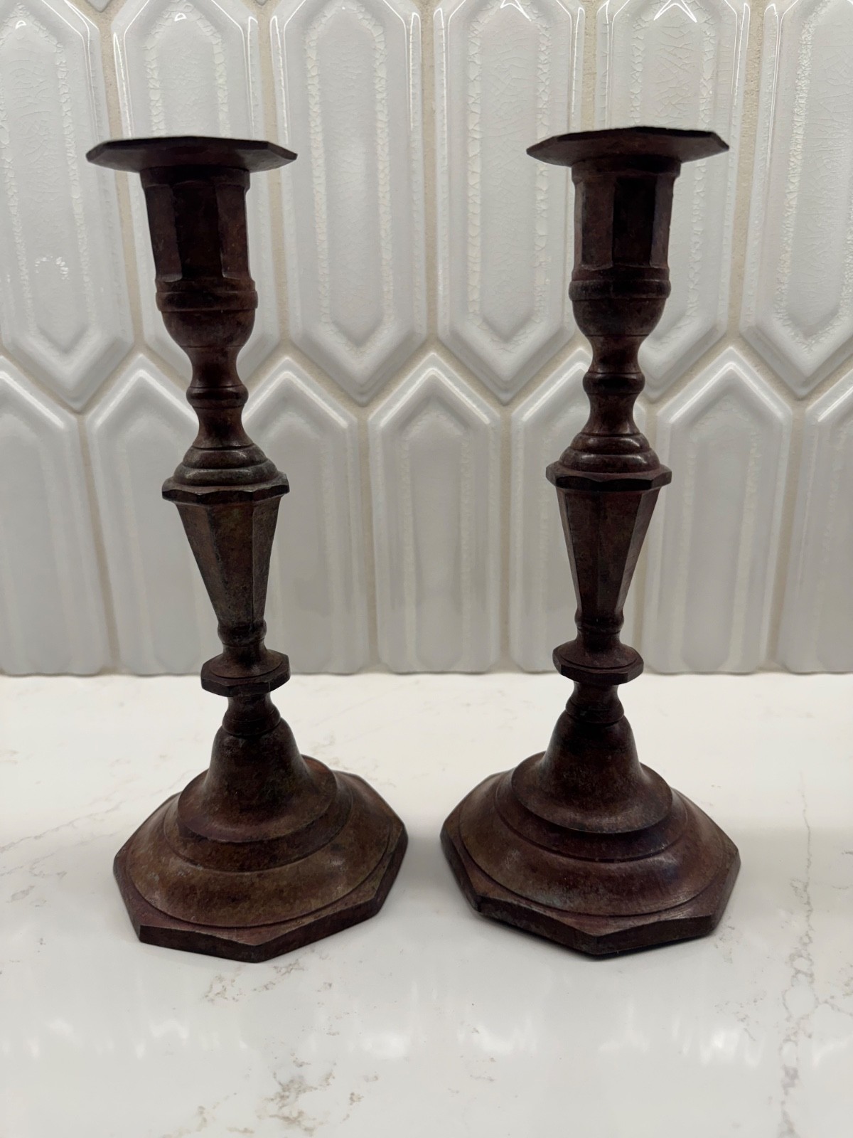  Pair of traditional turned metal candlesticks