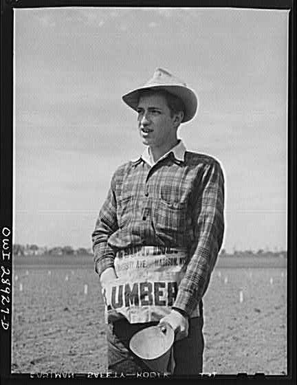 Photo:1928 Young Farmer in Field with Lumber Apron Hat