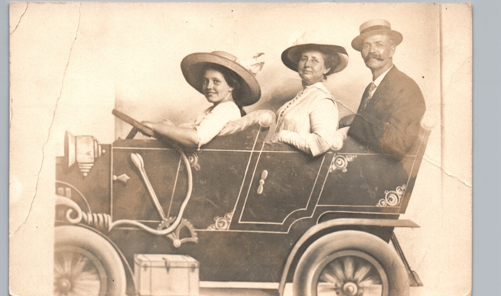 RIDING SILLY PROP CAR real photo postcard rppc family driving arcade auto