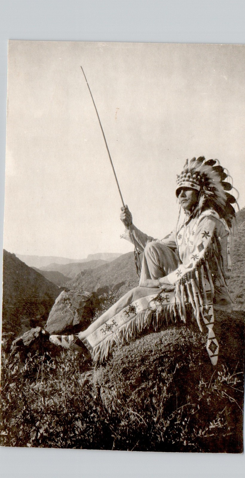 FULL HEADRESS INDIAN ON HILL c1940 postcard (trimmed) real photo rppc native