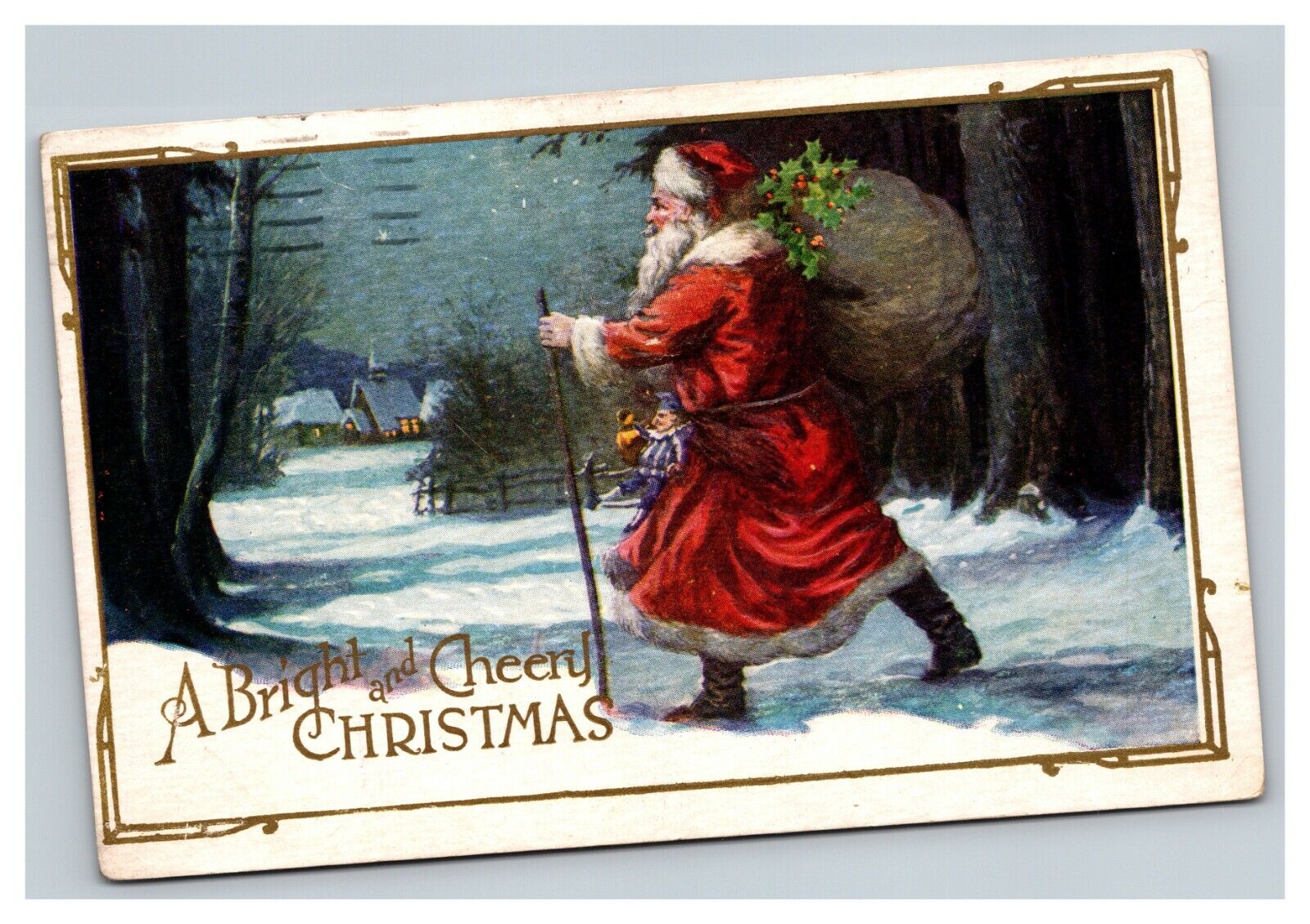 Vintage 1924 Christmas Postcard Santa with Presents Walking in Snowy Village