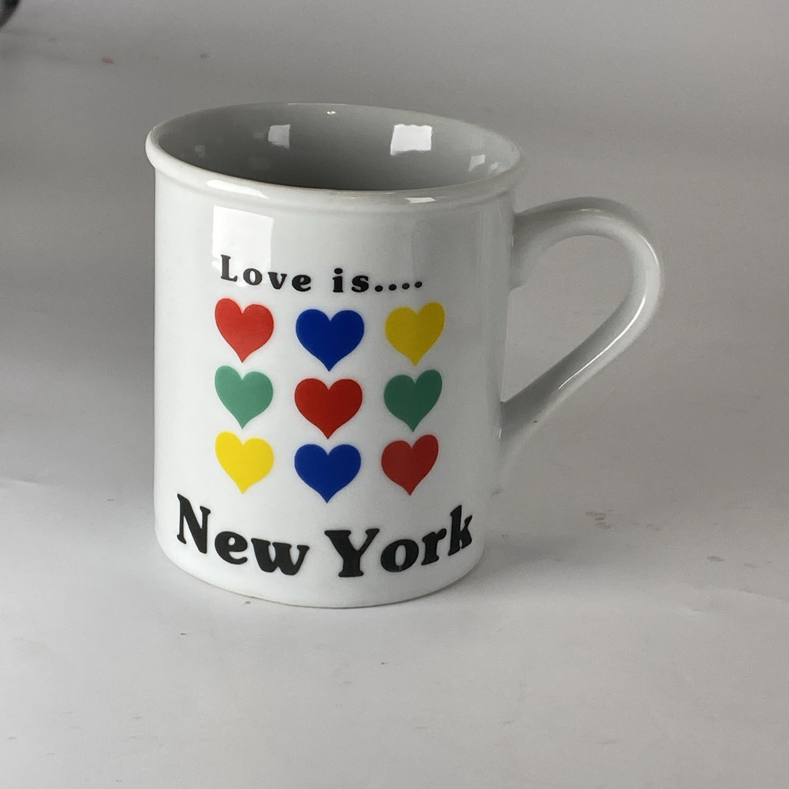 Vintage Papel Love is  New York red/blue/yellow/grn heart grid  Coffee Mug