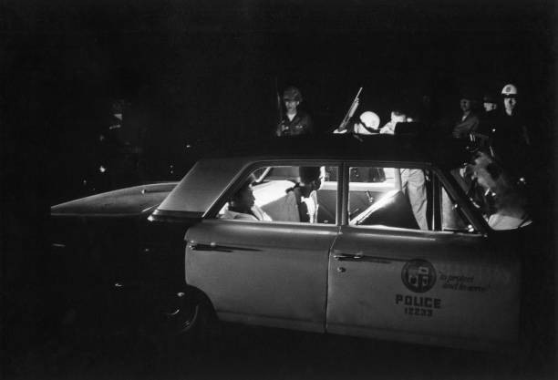 Los Angeles police arresting two Afro Americans a consequence of r- Old Photo