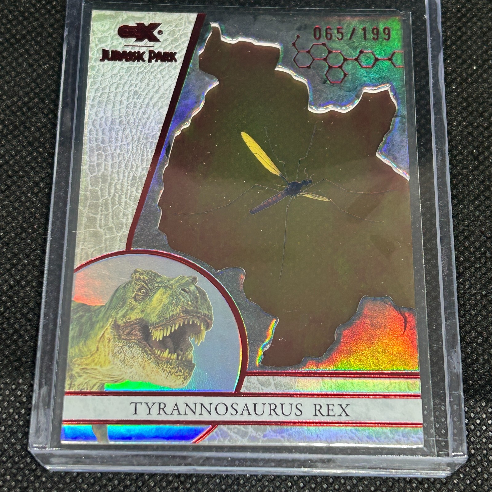 2026 JURASSIC PARK CRYPTOZOIC CZX T-REX AMBER INSERT #A8 RED PARALLEL #d 065/199