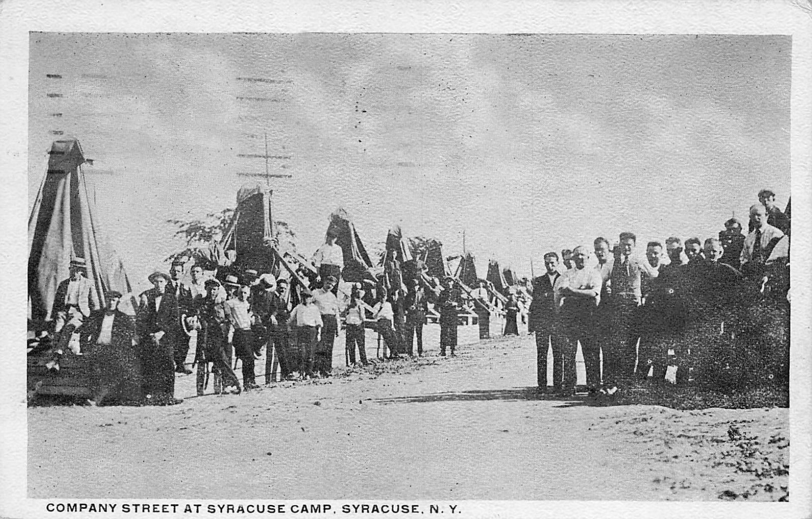 1913 NEW YORK PHOTO POSTCARD: MEN ON COMPANY STREET AT SYRACUSE CAMP, NY