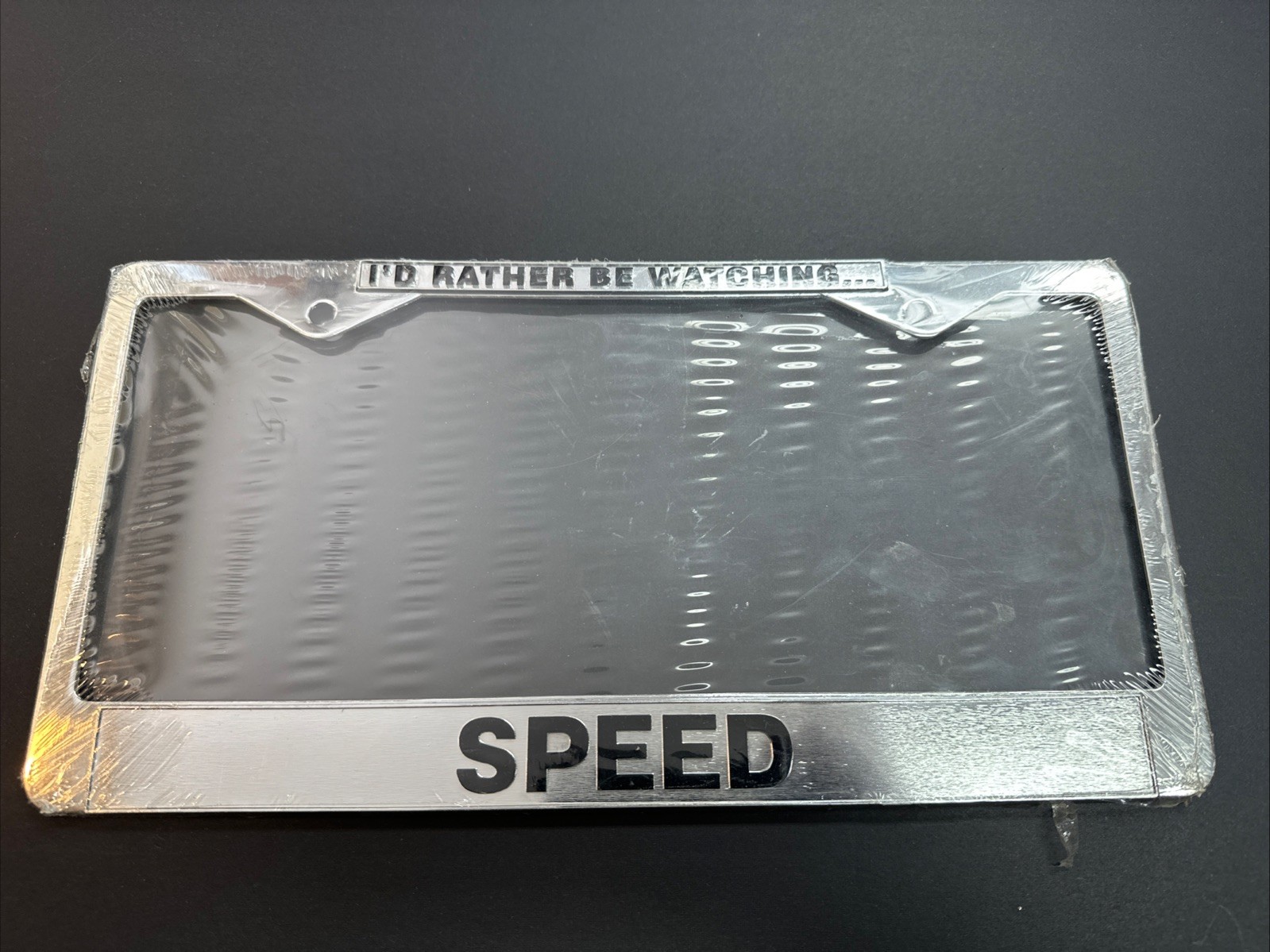 Vintage “I'd Rather Be Watching Speed” Metal License Plate Frame NOS Racing Cars