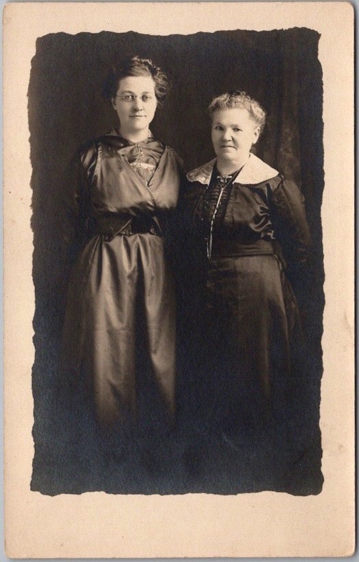 c1910s Studio Photo RPPC Postcard 2 Ladies in Black Dresses / Black Background
