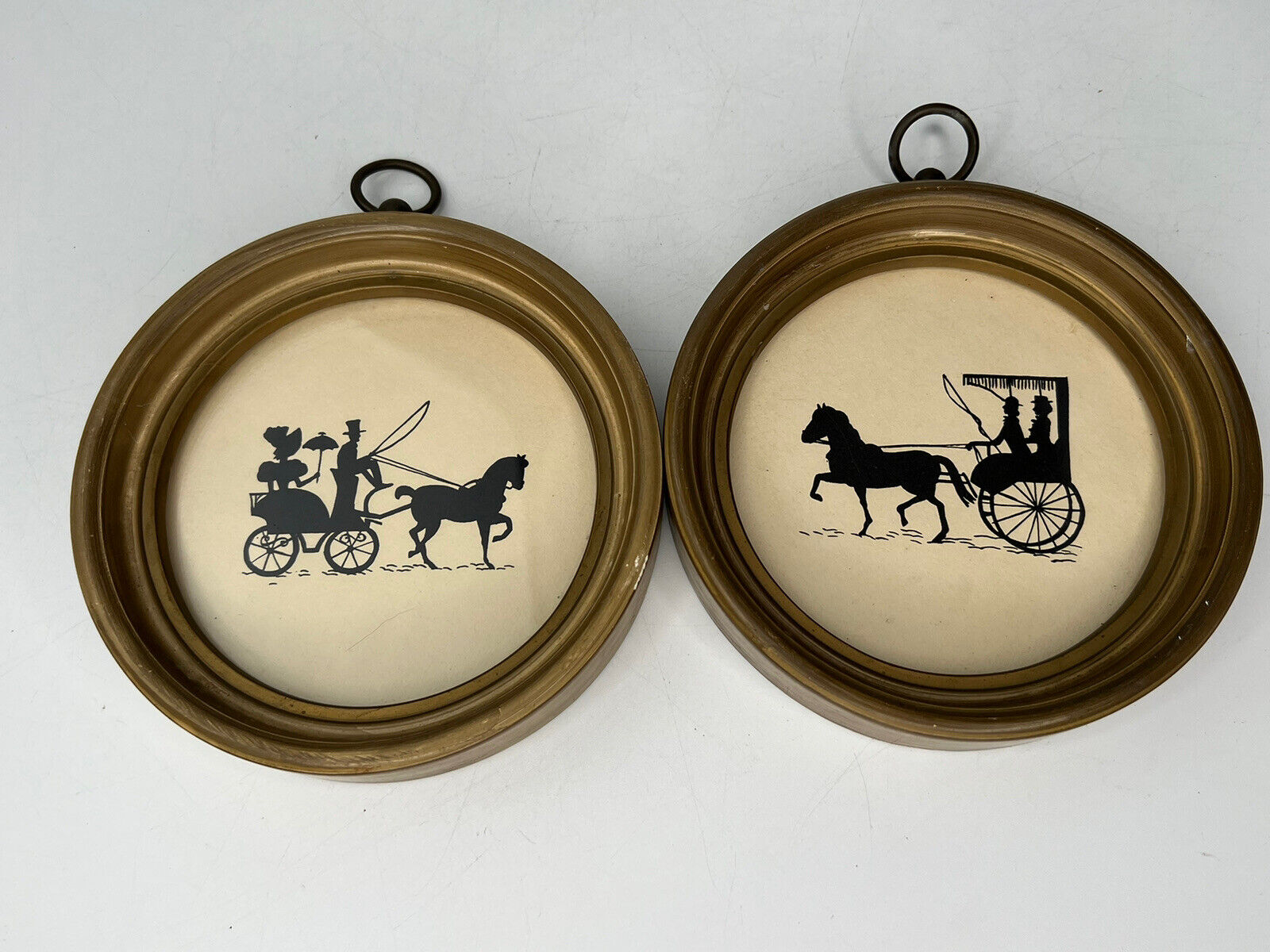 Vintage Silhouette Horse and buggy pictures in round gold frames 