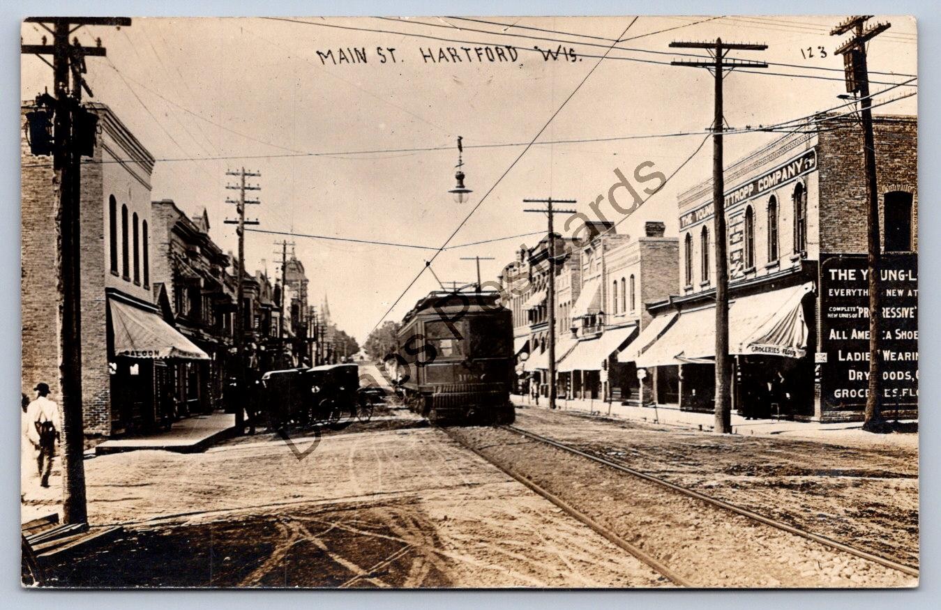 K67/ Hartford Wisconsin RPPC Postcard c1910 Main Street Trolley Stores 324